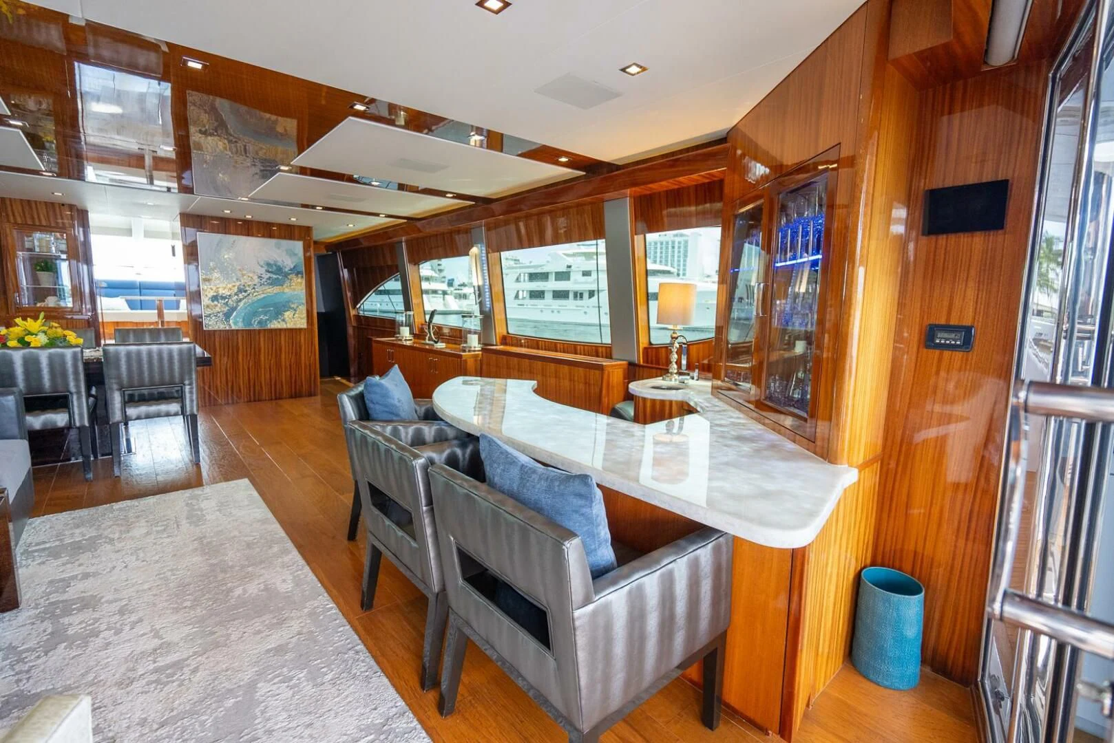 a large room with a table and chairs aboard RITZ SEA Yacht for Sale