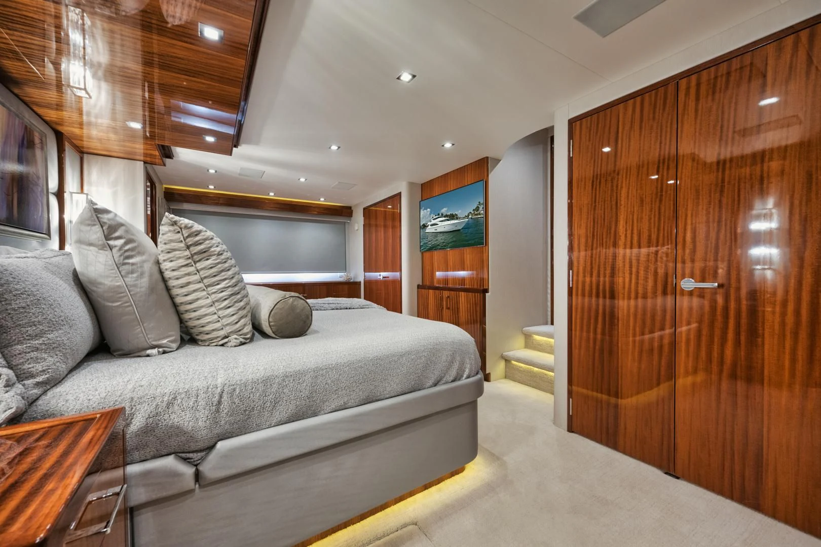 a living room with a couch and a wood door aboard RITZ SEA Yacht for Sale