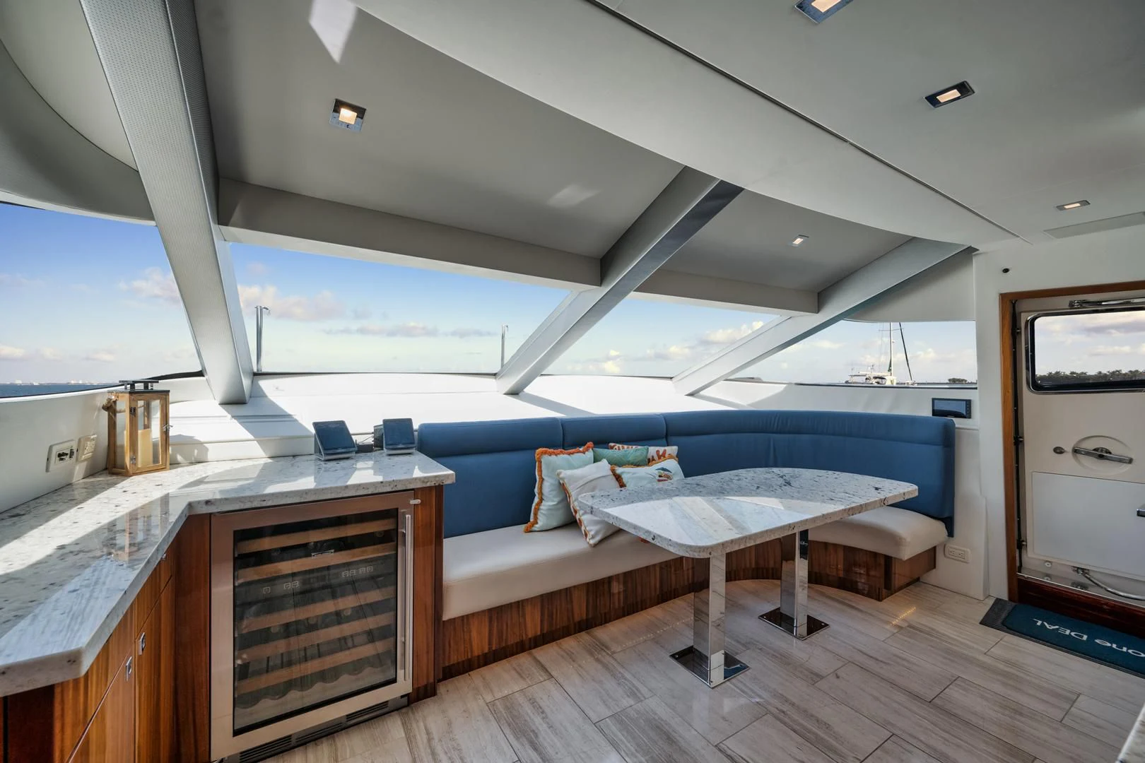 a room with a bed and a table aboard RITZ SEA Yacht for Sale
