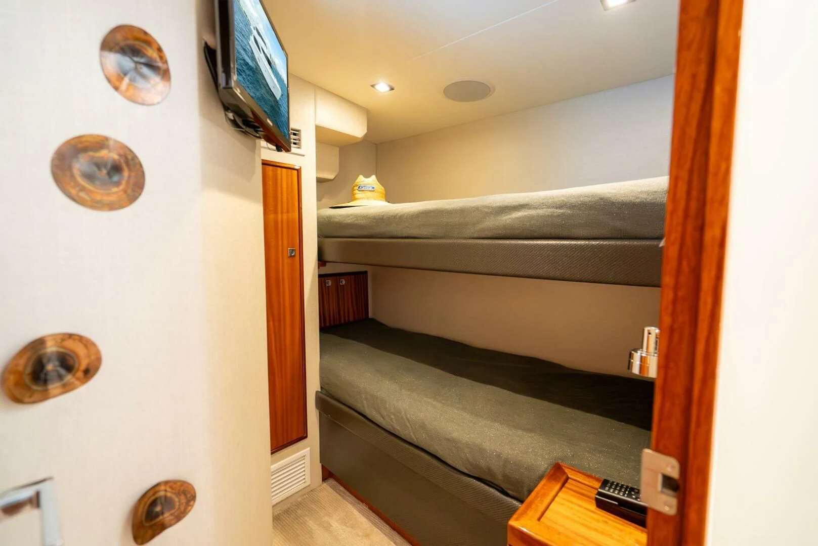 a room with a bed and a television aboard RITZ SEA Yacht for Sale