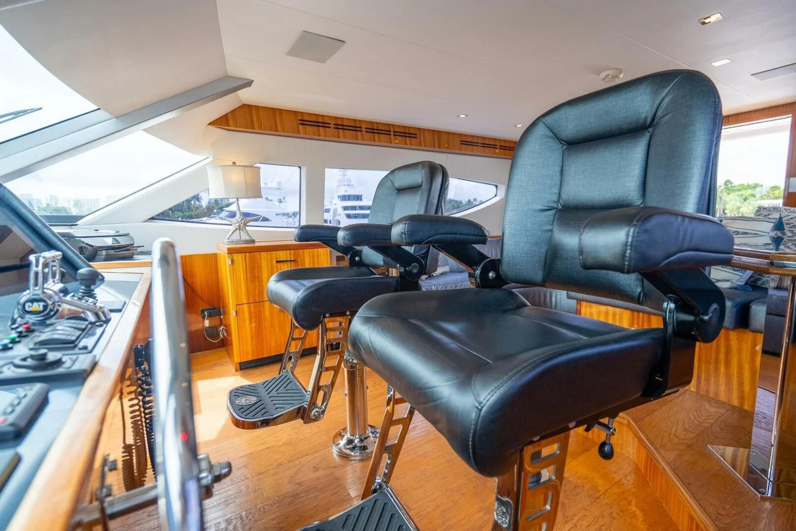 a black leather chair in a room aboard RITZ SEA Yacht for Sale
