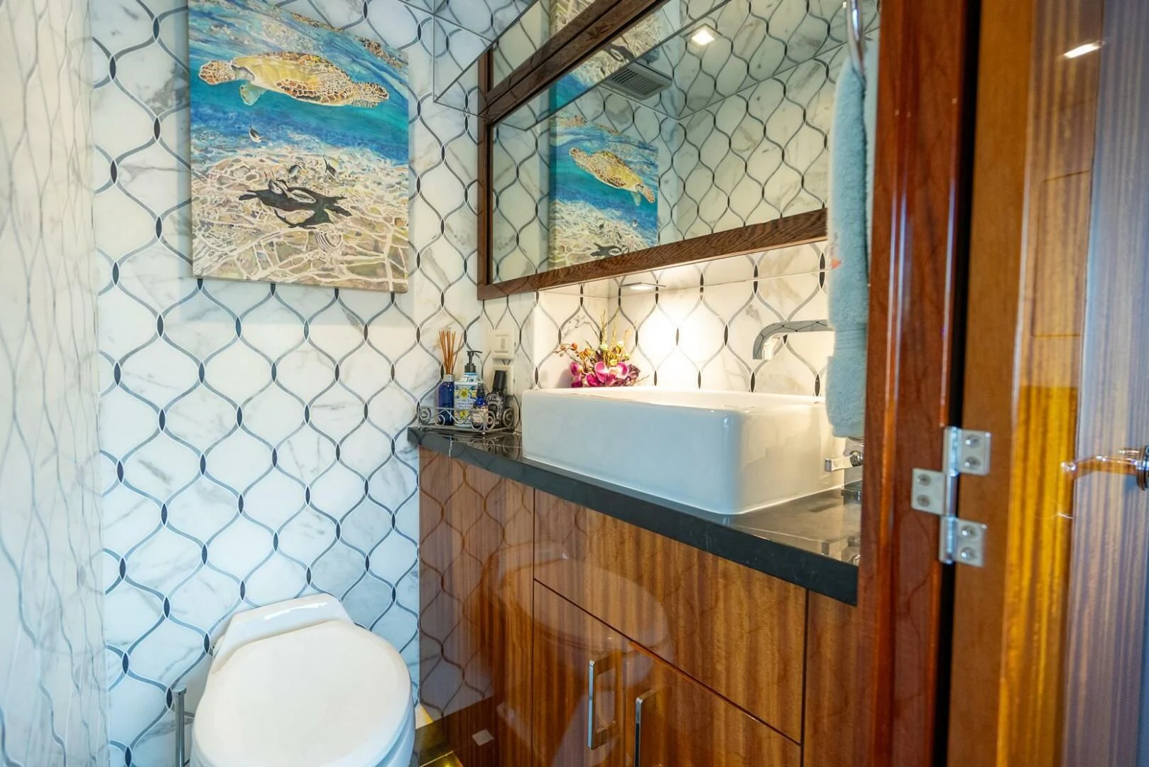 a bathroom with a sink and toilet aboard RITZ SEA Yacht for Sale