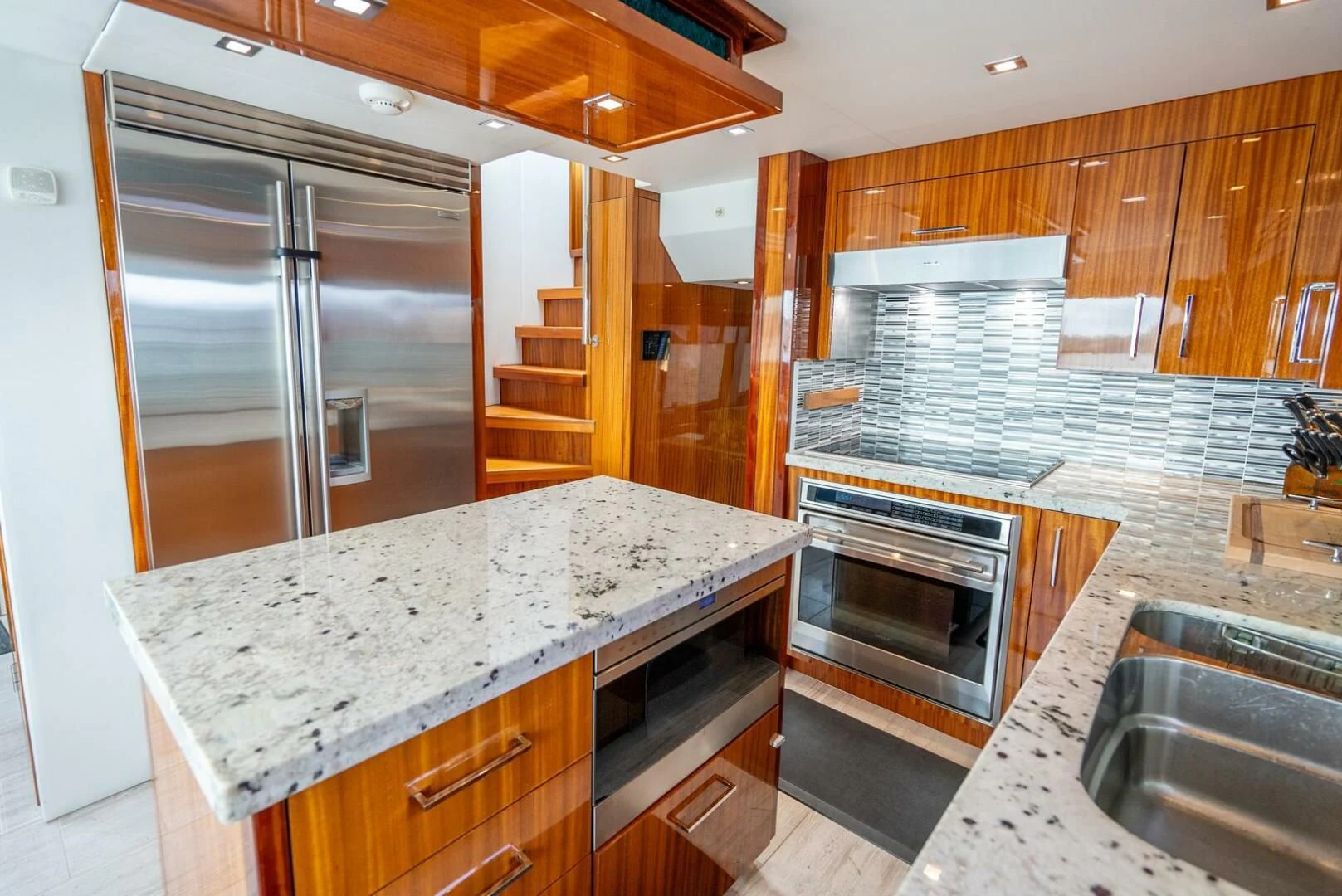 a kitchen with stainless steel appliances aboard RITZ SEA Yacht for Sale