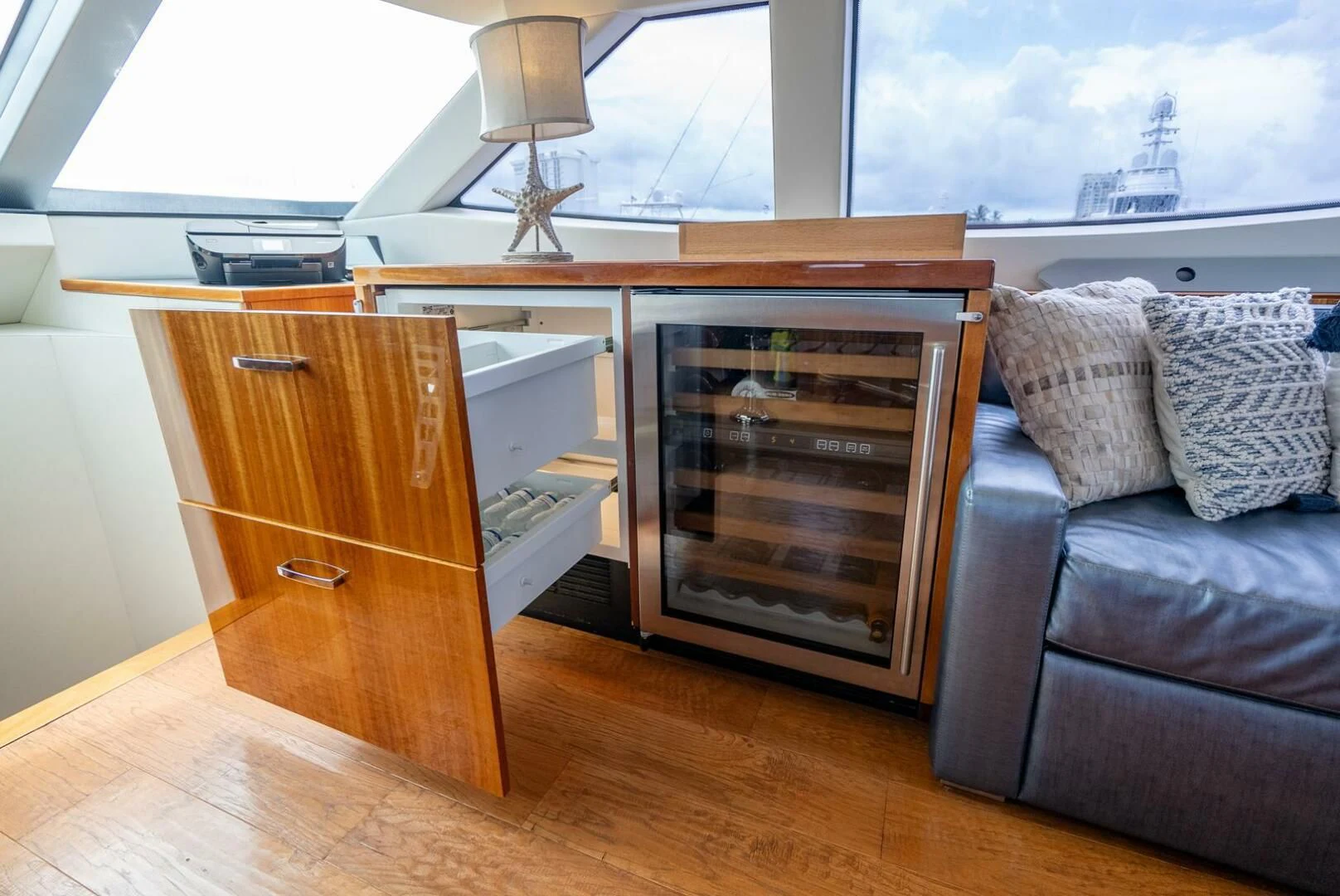 a living room with a fireplace aboard RITZ SEA Yacht for Sale