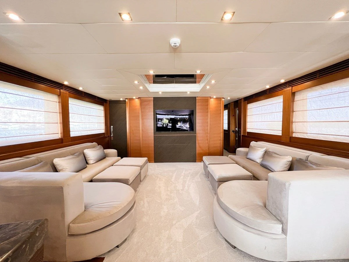 a room with couches and a television aboard MATSU Yacht for Sale