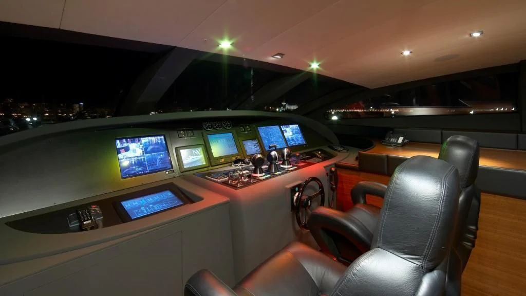 a room with many monitors and chairs aboard MATSU Yacht for Sale