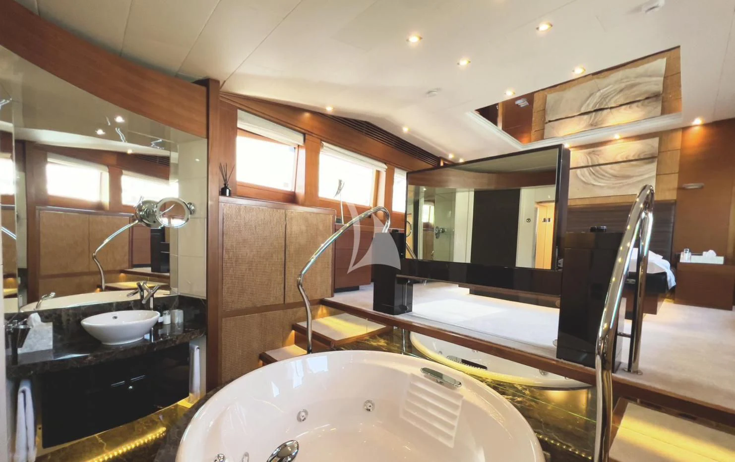 a bathroom with a tub sink and mirror aboard MATSU Yacht for Sale