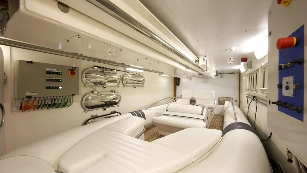 a room with beds and a machine aboard MATSU Yacht for Sale