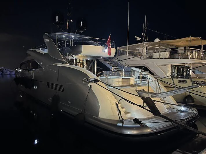 a boat docked at night aboard MATSU Yacht for Sale