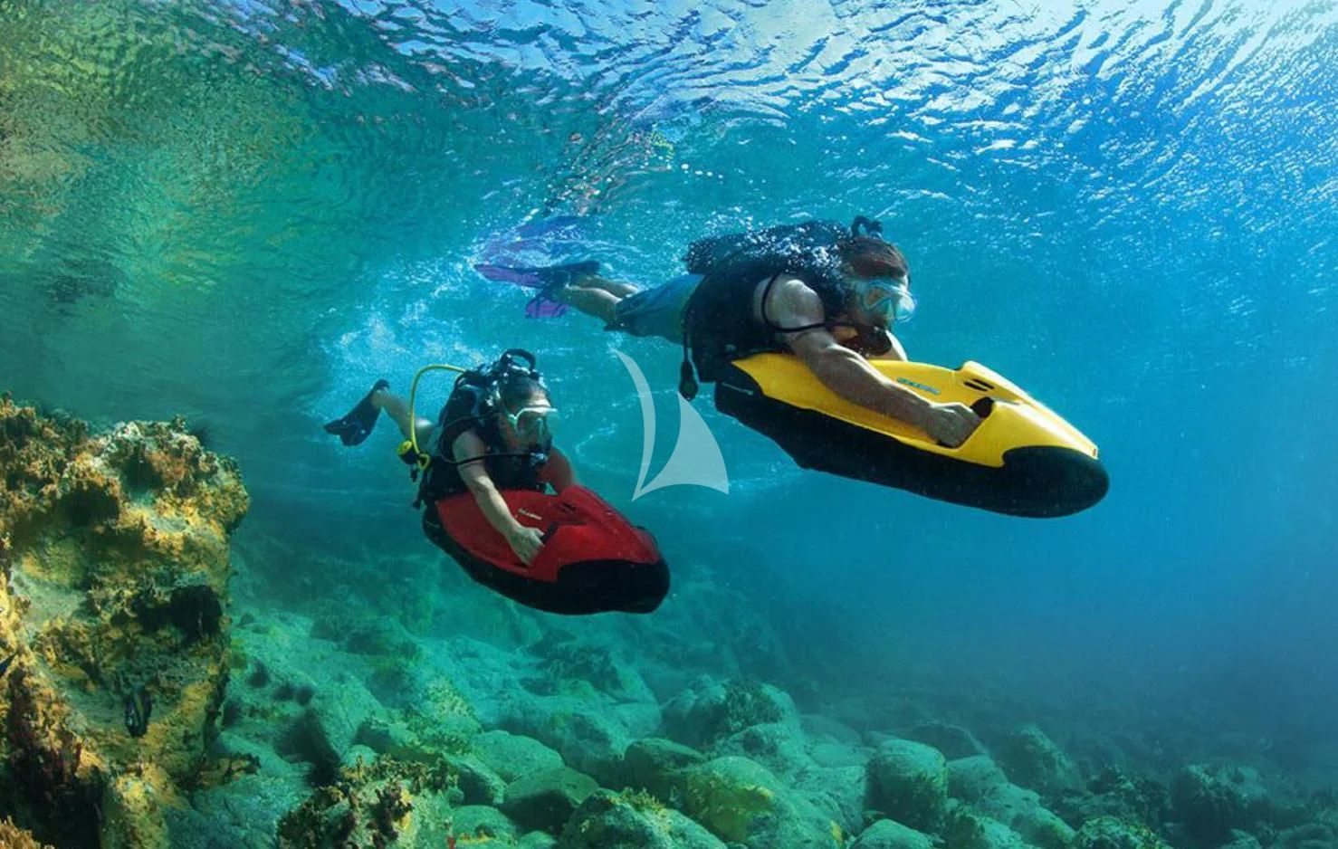 a man and a woman in a kayak in the water aboard MATSU Yacht for Sale
