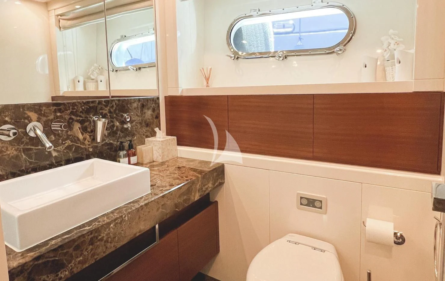 a bathroom with a sink and a mirror aboard MATSU Yacht for Sale