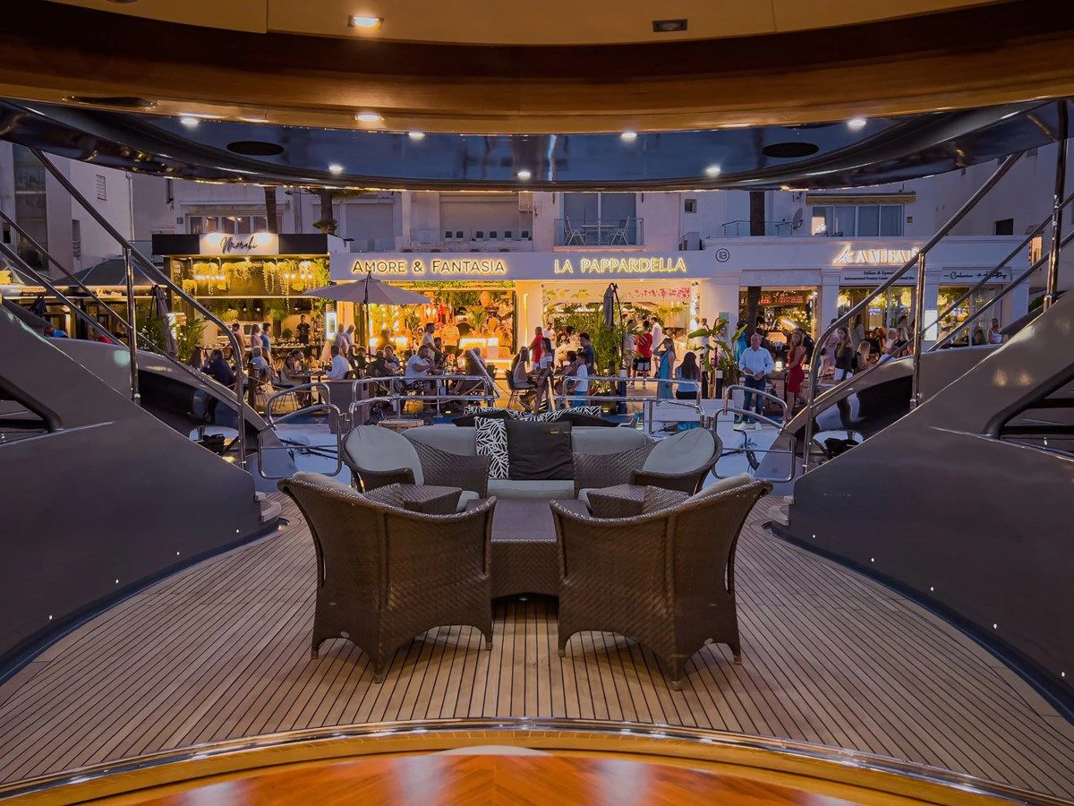 a restaurant with a large table and chairs aboard MATSU Yacht for Sale