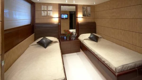 a room with wooden walls and a bed aboard MATSU Yacht for Sale