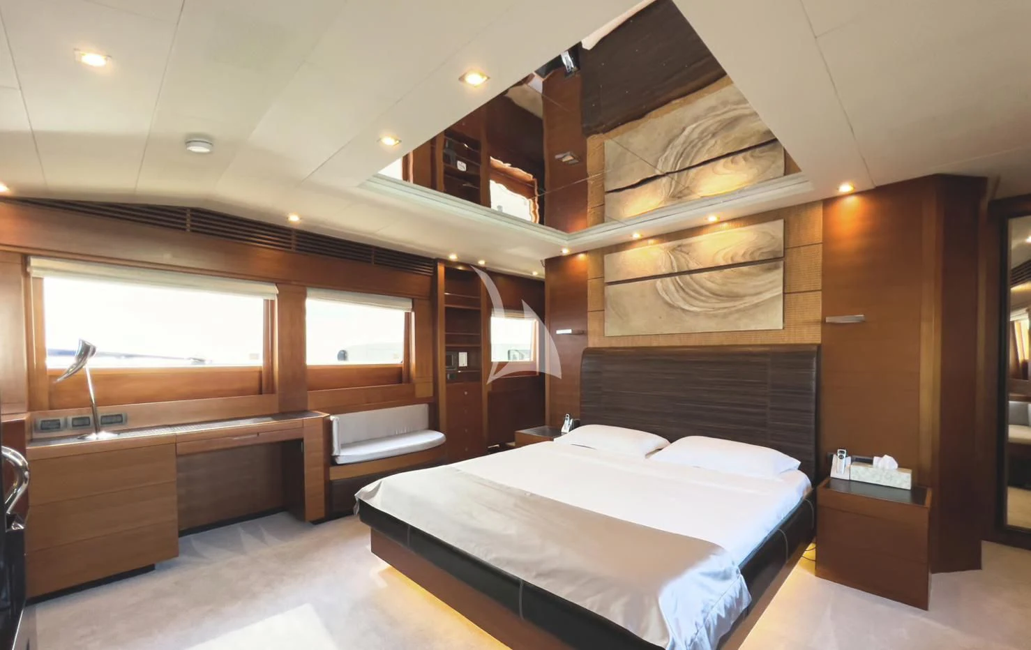 a room with a bed and a desk aboard MATSU Yacht for Sale