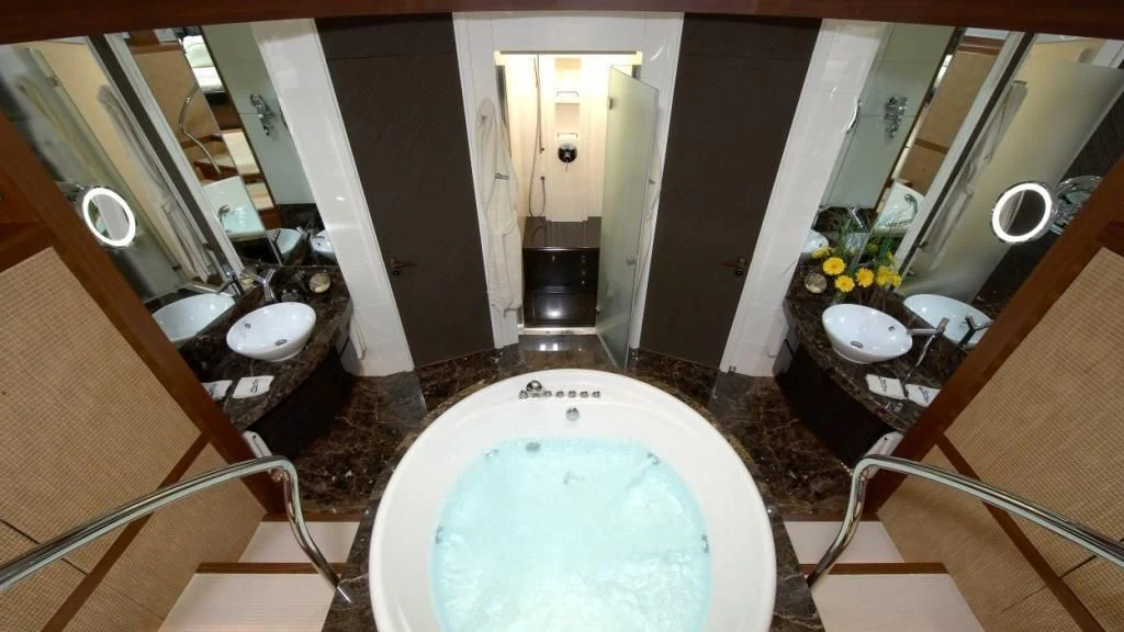 a bathroom with a tub sink and sinks aboard MATSU Yacht for Sale