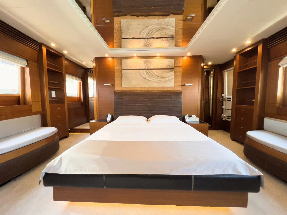 a room with a bed and a couch aboard MATSU Yacht for Sale