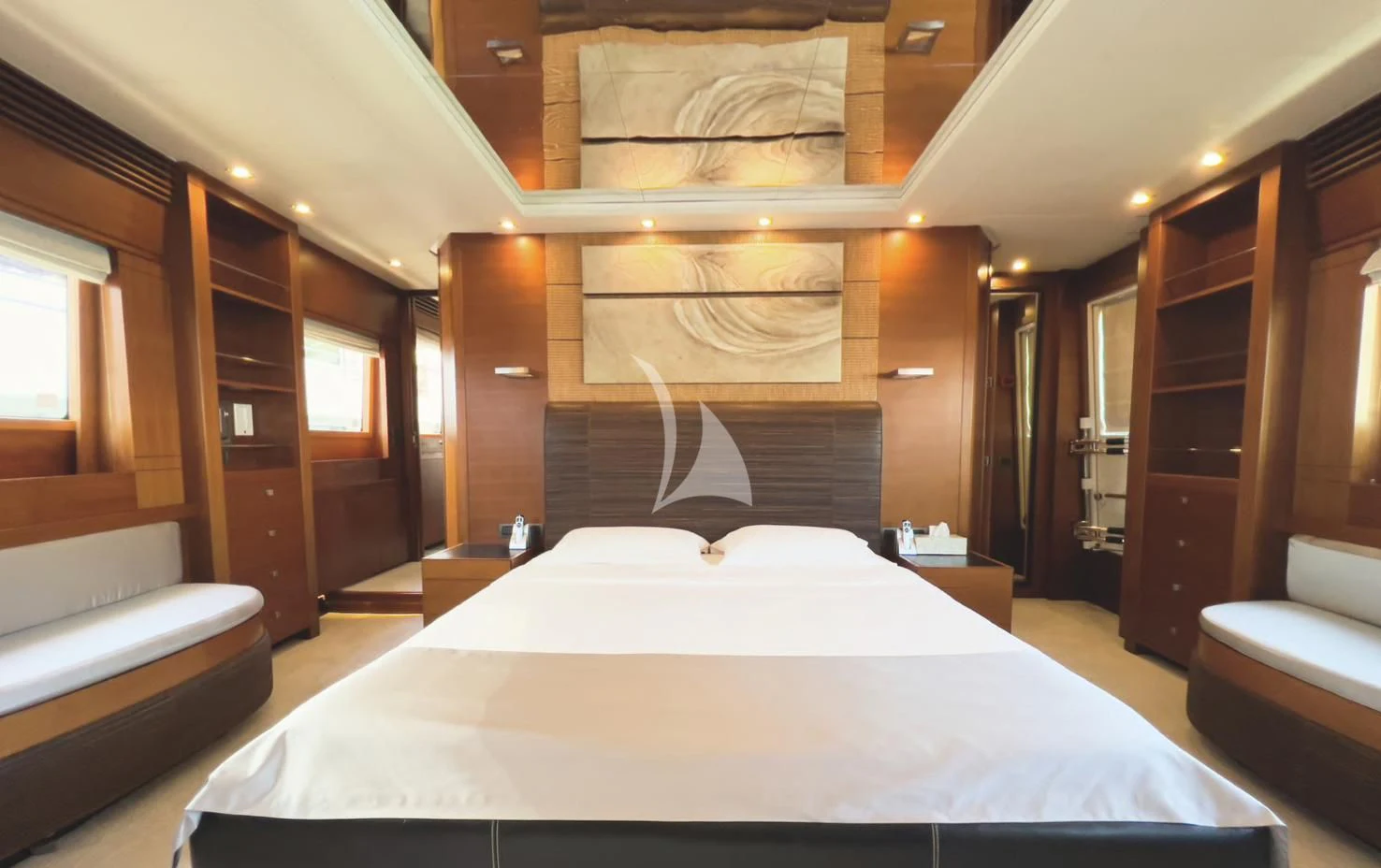 a room with a bed and a chair aboard MATSU Yacht for Sale
