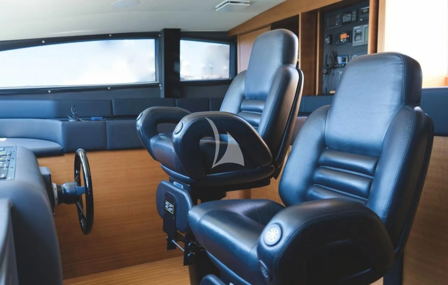 a group of chairs in a room aboard MATSU Yacht for Sale