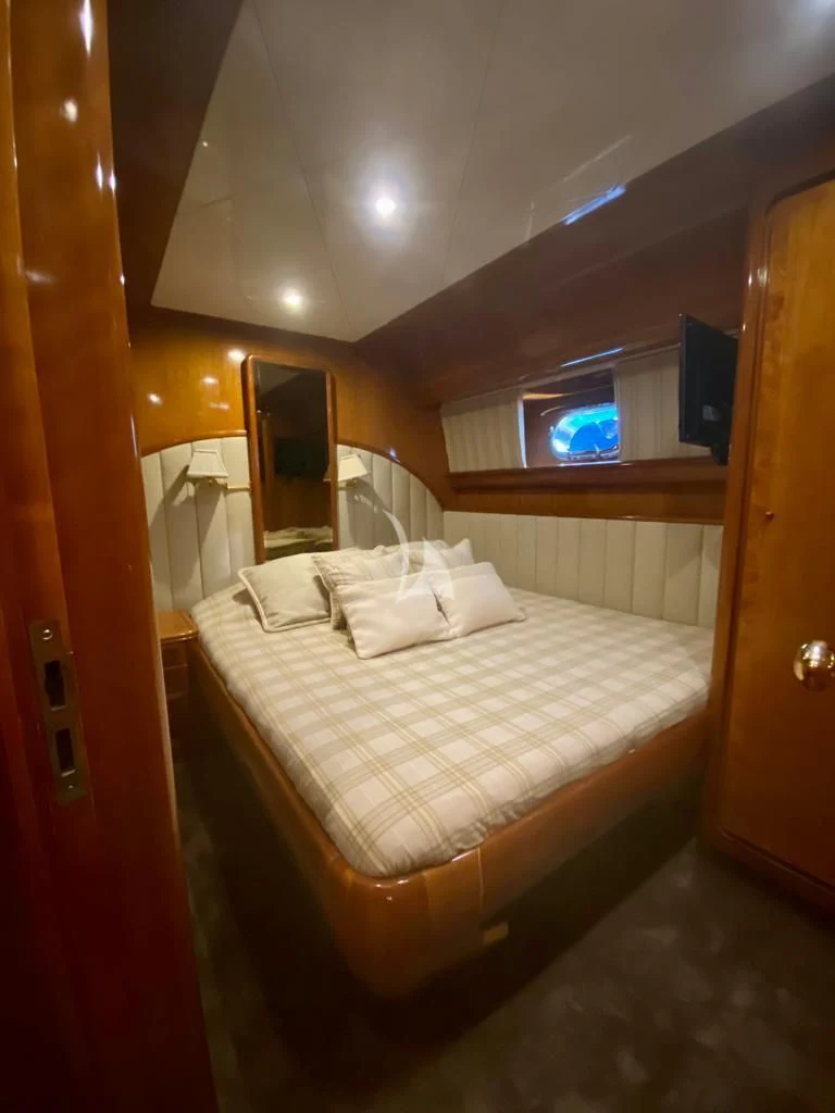 a bed in a room aboard BLU SKY Yacht for Sale