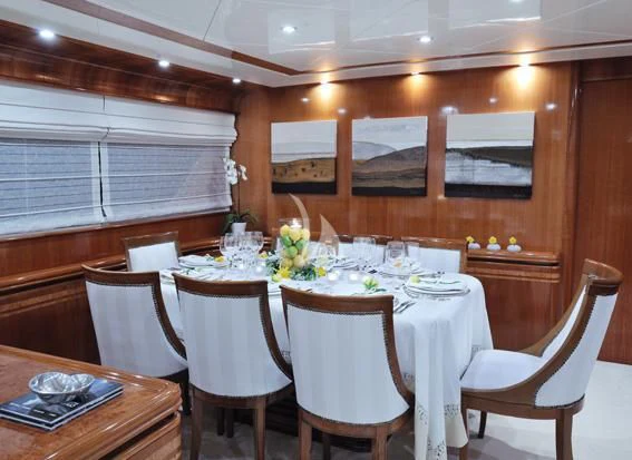 a table set for a wedding reception aboard BLU SKY Yacht for Sale