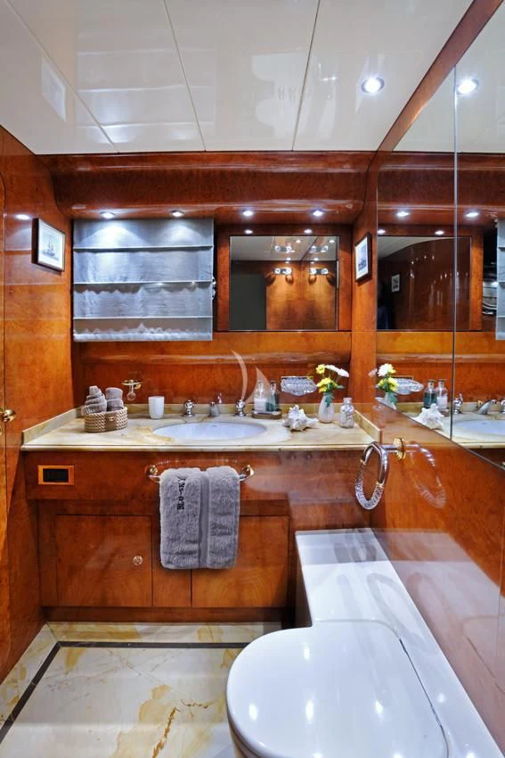 a bathroom with a large mirror aboard BLU SKY Yacht for Sale