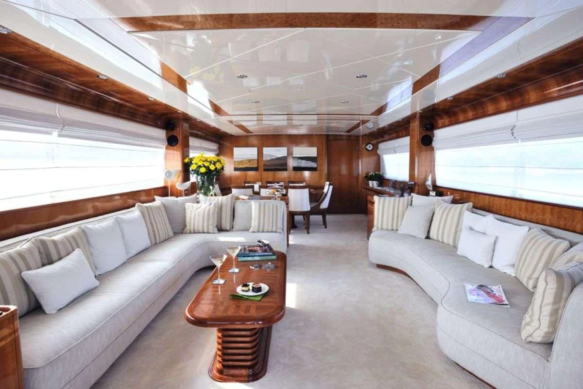 a living room with a couch and a coffee table aboard BLU SKY Yacht for Sale