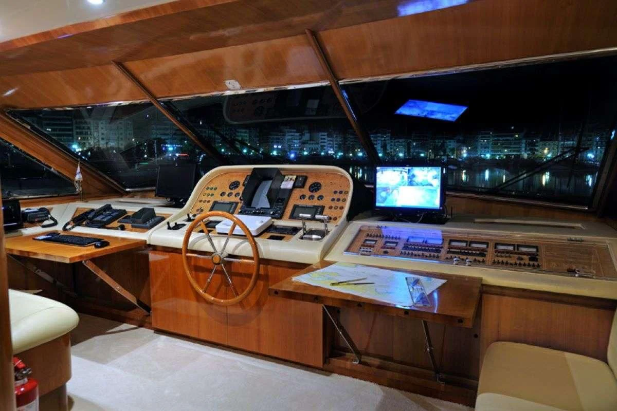 a control room with a large screen aboard BLU SKY Yacht for Sale
