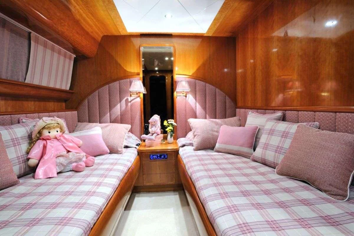 a couple of beds in a room aboard BLU SKY Yacht for Sale