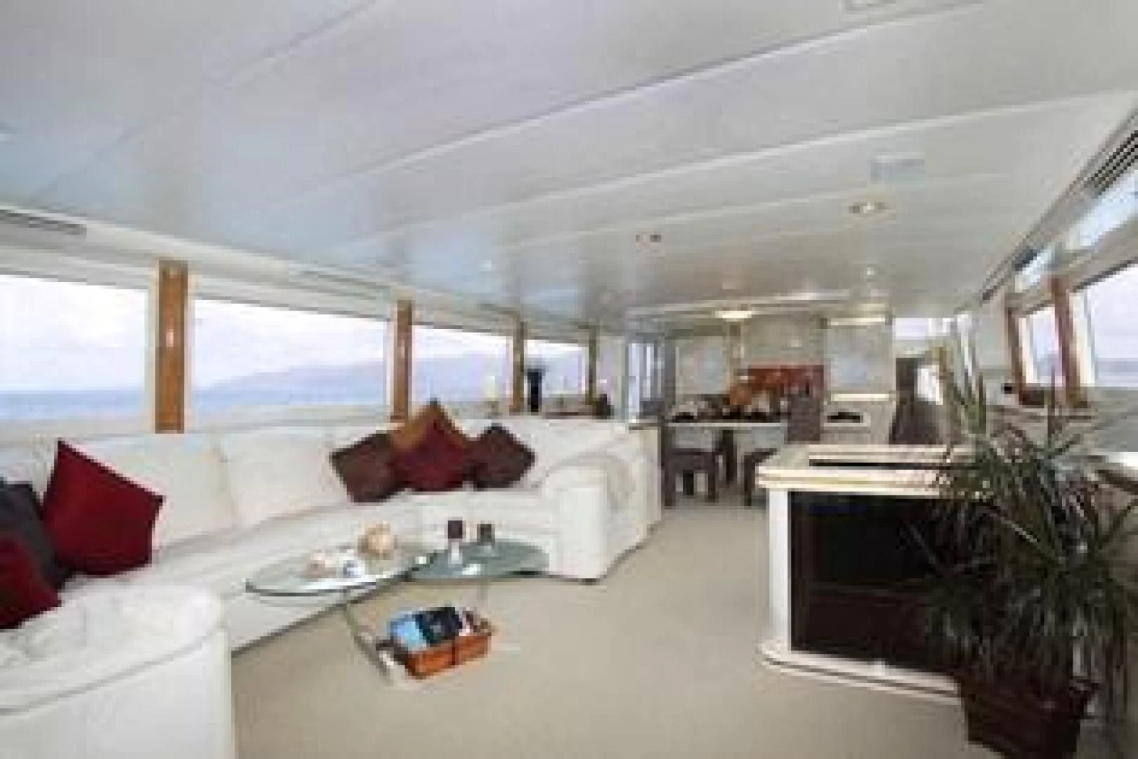 a large living room with a large window aboard HARLINA Yacht for Sale
