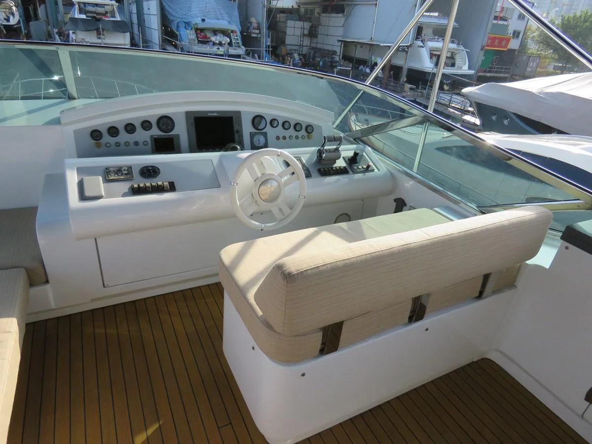 a white boat in a showroom aboard AERBIN Yacht for Sale