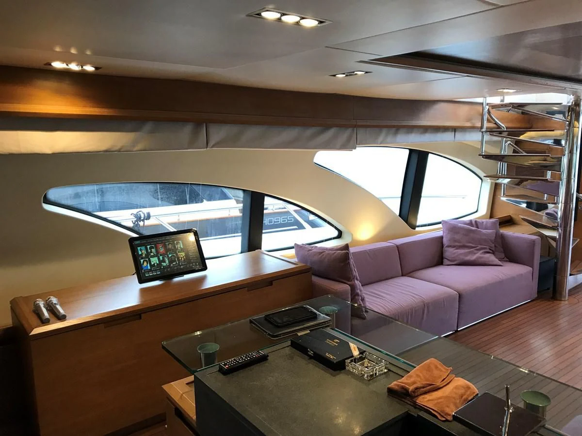 a living room with a couch and a table aboard AERBIN Yacht for Sale