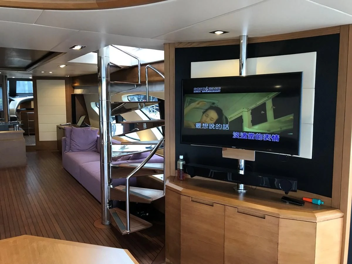 a tv on a stand in a room aboard AERBIN Yacht for Sale