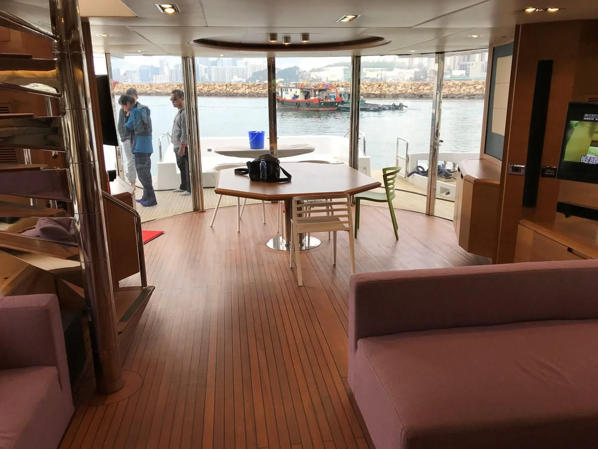 a room with a table and chairs aboard AERBIN Yacht for Sale