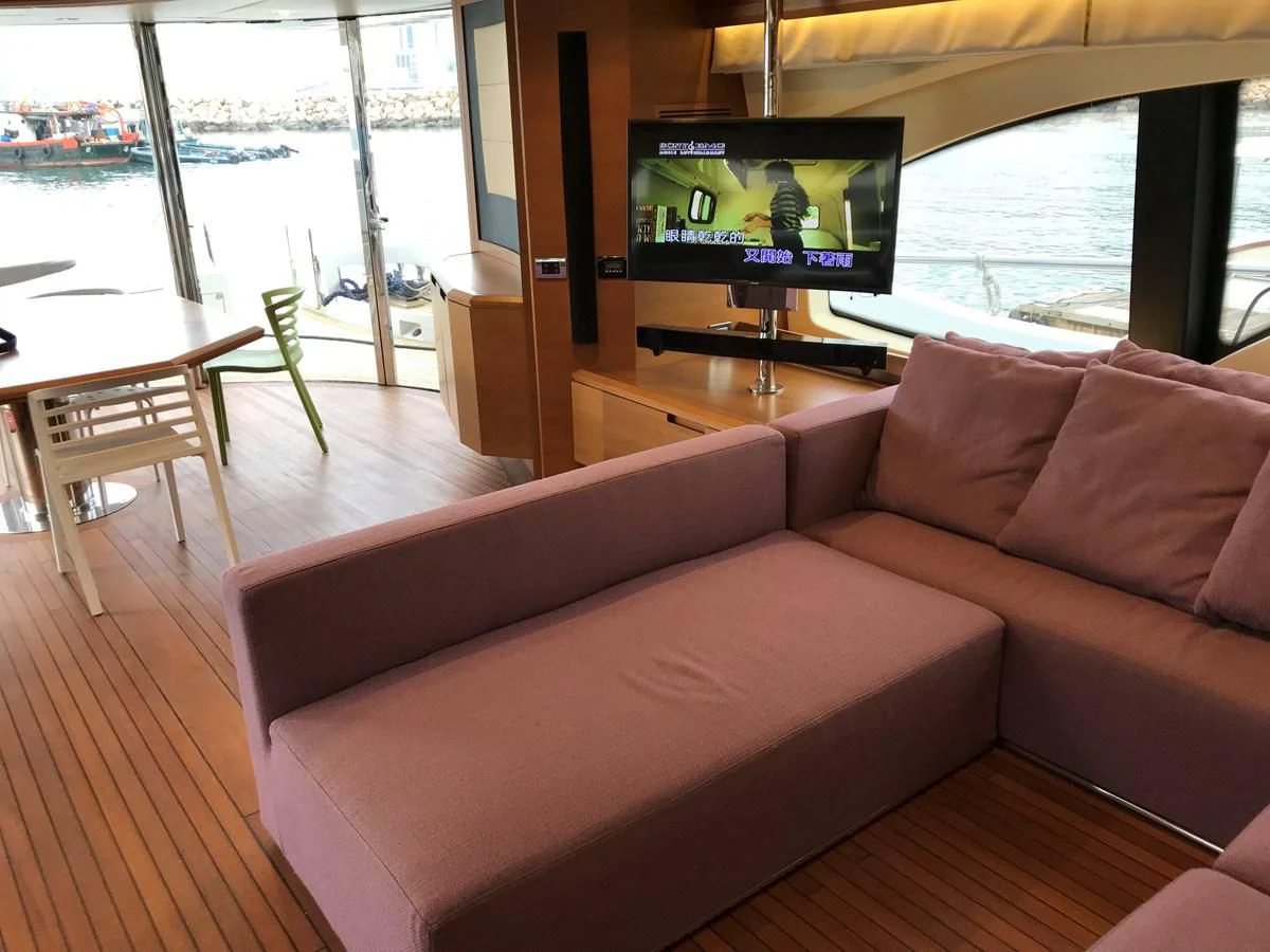 a couch with a tv on it aboard AERBIN Yacht for Sale