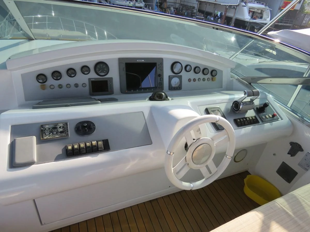 a white car with a screen aboard AERBIN Yacht for Sale