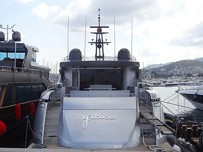 a boat docked at a pier aboard GRACE Yacht for Sale