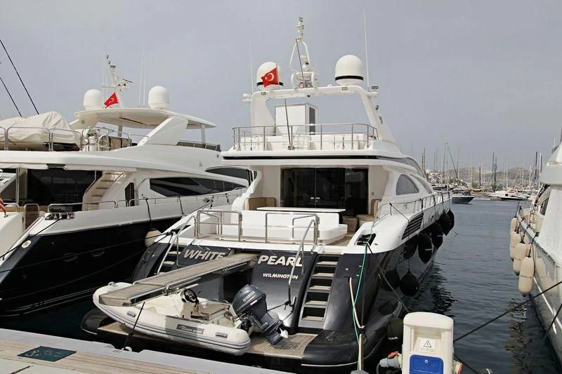 a boat docked at a pier aboard WHITE PEARL Yacht for Sale