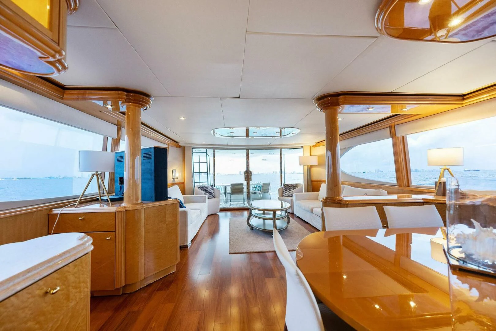 a room with a wood floor and a large window with a desk and a large window aboard NORDLYS Yacht for Sale