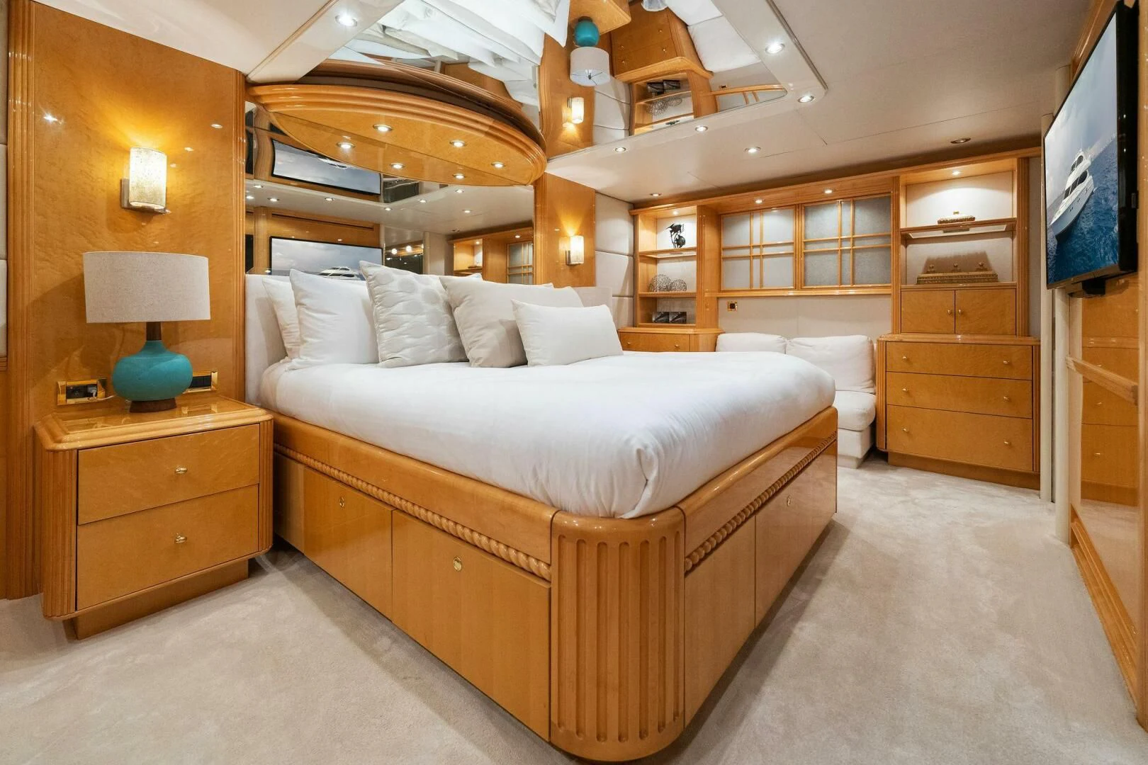 a bedroom with a bed and a dresser aboard NORDLYS Yacht for Sale
