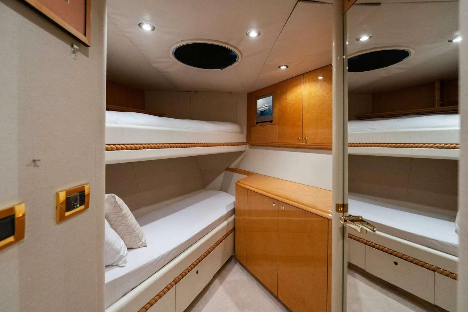 a room with a bed and a window aboard NORDLYS Yacht for Sale