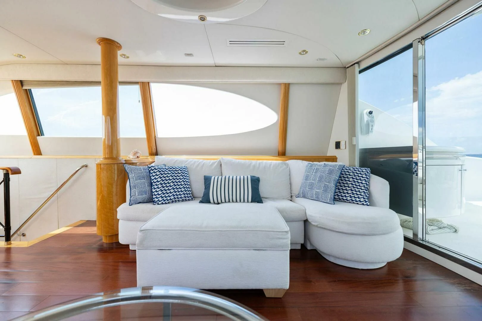 a living room with white couches aboard NORDLYS Yacht for Sale