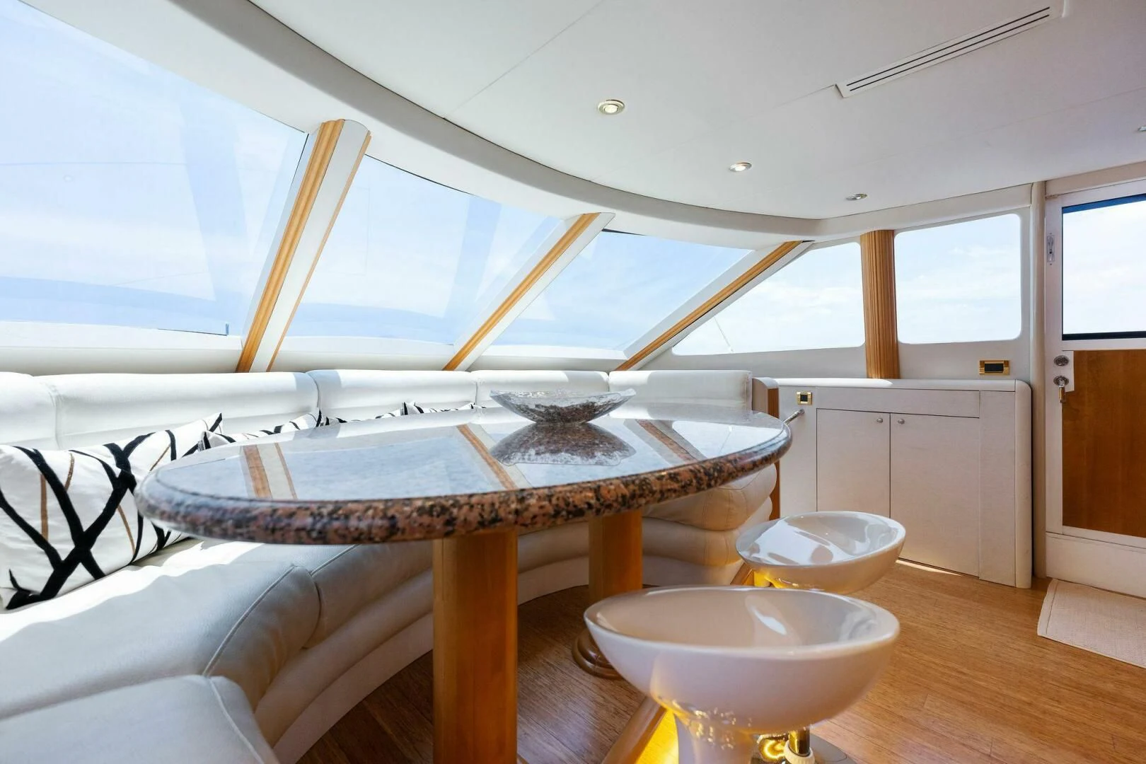 a room with a table and a bed aboard NORDLYS Yacht for Sale