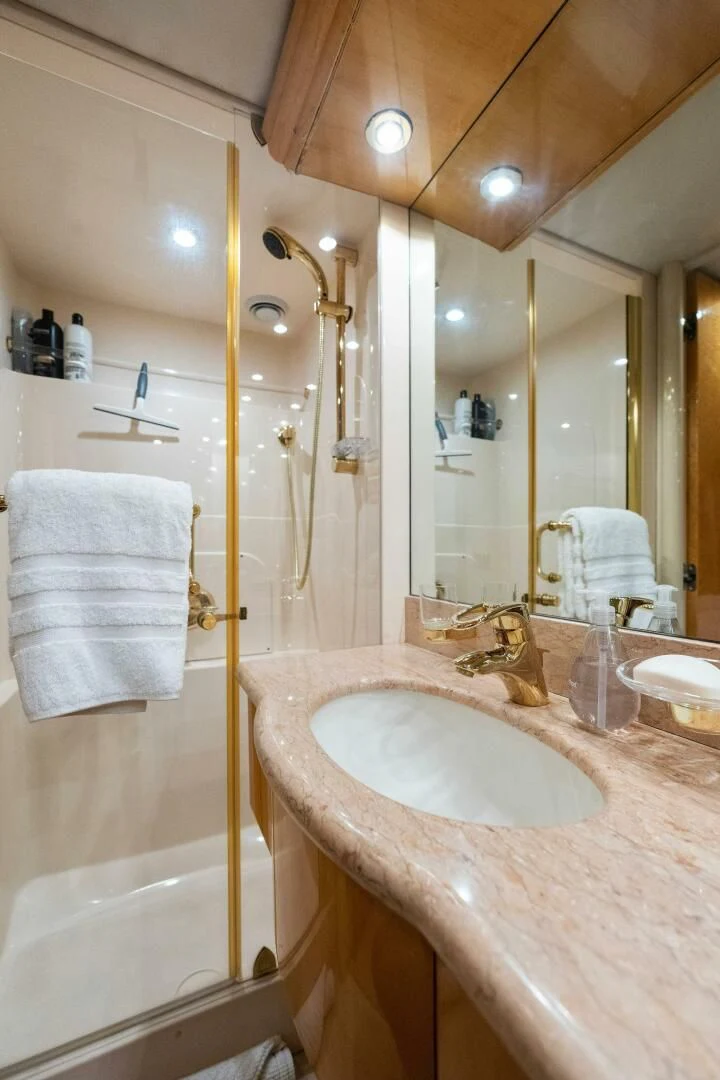 a bathroom with a shower and sink aboard NORDLYS Yacht for Sale