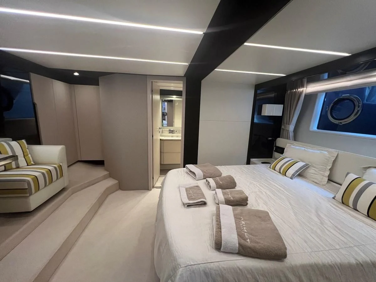 a room with a bed and a desk aboard PAVIMAR II Yacht for Sale