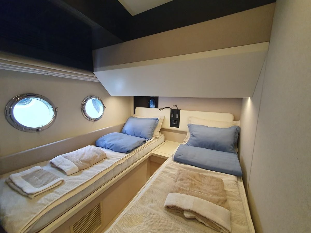 a room with two beds aboard PAVIMAR II Yacht for Sale