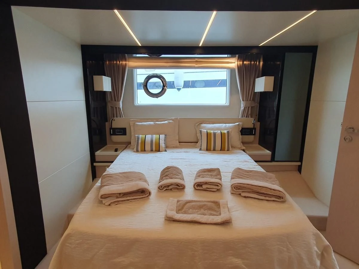 a hotel room with a bed aboard PAVIMAR II Yacht for Sale