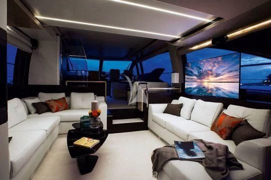 a living room with a large window aboard PAVIMAR II Yacht for Sale