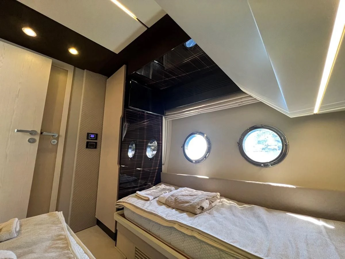 a bed in a room aboard PAVIMAR II Yacht for Sale