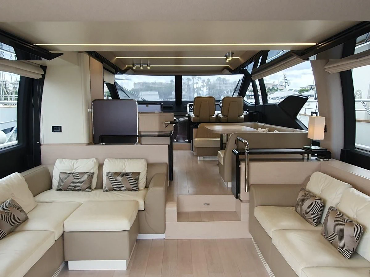 a living room with a couch and a tv aboard PAVIMAR II Yacht for Sale