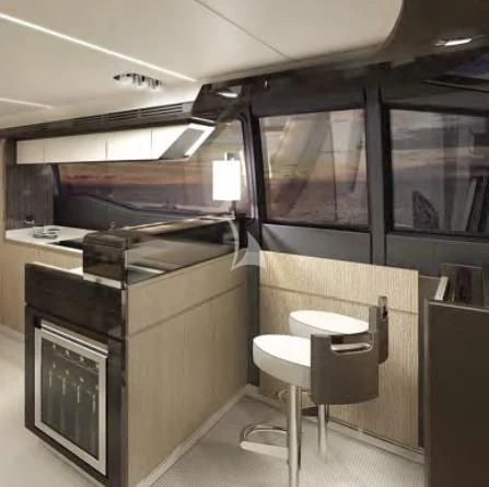 a room with a desk and stools aboard PAVIMAR II Yacht for Sale